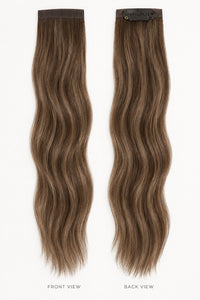 Bang Booster clip-in hair extensions in mixed brown and blonde, with long wavy strands and discreet mini clips.