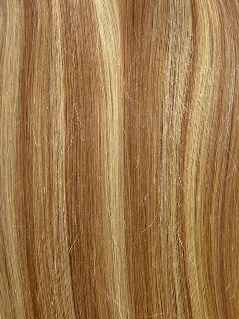 Bang Booster hair extension in mixed blonde and light brown human hair, with straight strands and subtle highlights.