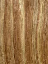 Bang Booster hair extension in mixed blonde and light brown human hair, with straight strands and subtle highlights.