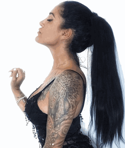 Ponytail Hair Extensions in jet black, worn long and straight with a smooth, sleek finish and wrapped base